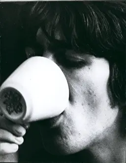 Heave: George Harrison of The Beatles pop group, cup of tea