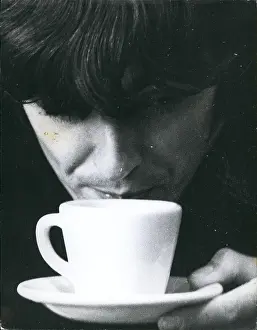 Outsize: George Harrison of The Beatles pop group, cup of tea