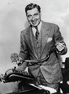 Cheques: George L. McCarthy with his invention: