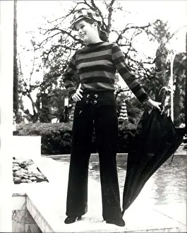 Slacks: Geraldine Chaplin, actress, posing by hotel pool, Cannes