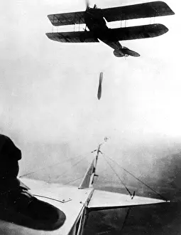 Dropping: German airplane dropping a bomb, 1916