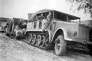 Pulls: German artillery tractor with an 8.8 cm Flak, 1941