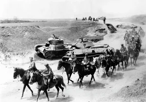 T 34: German cavalry riding past downed Russian tanks, 1941