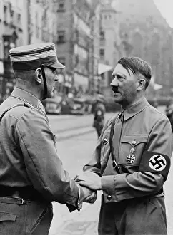Holding Hands: German Chancellor, Adolf Hitler, shaking hands with