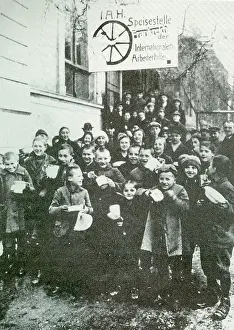 Receive: German children receive soup at a communal kitchen