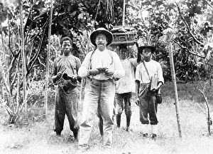 Togo: German colonial official with bearers, 1907