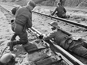 Remove: German engineers remove an explosive charge from railway tra