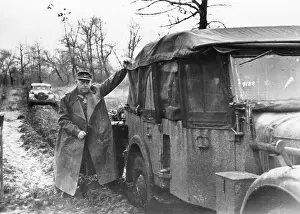 Bigger: A German general pushes his car on the Eastern Front, 1944