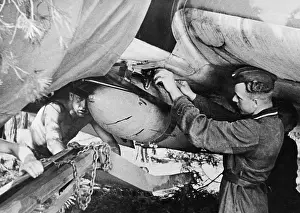 Fuselage: German ground crew loads a Stuka with bombs, 1941