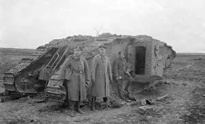 Cambrai: German infanterists in front of a British tank, 1917