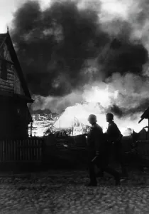 Scorched: German infantry in a burning village on the Eastern Front