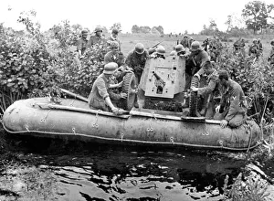 Loads: German infantry at a river crossing in Netherlands, 1940