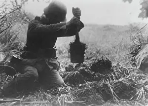 Folding: German infantryman digging in, 1942