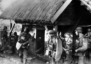 Dispersed: German infantrymen search a house on the Eastern Front, 1941