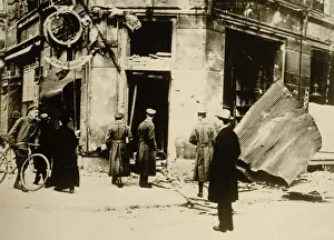 7 People: German men standing in front of a destroyed police