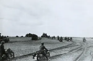 Identifies: German motorcycle invasion troops in the Summer