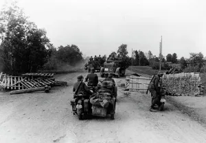 Relatively: German motorized troops pass through a roadblock on the