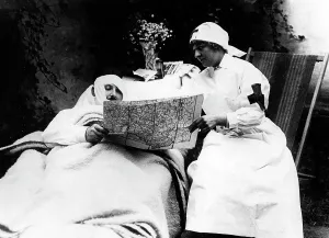 Sanitary: German nurse with a Belgian soldier, 1914
