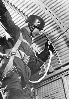 Attaches: German paratrooper before jumping, 1942