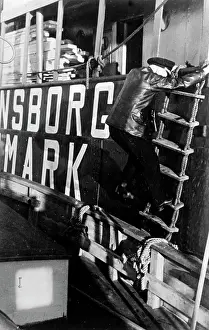 Neutral: German pilot boarding a neutral ship, 1940