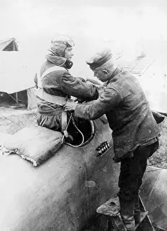 Climbs: German pilot climbs into his machine, 1918