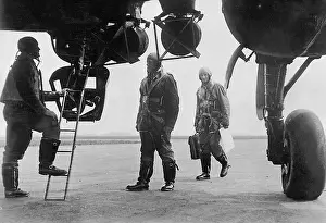 Mounts: German pilots climb into a bomber, 1940