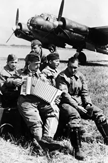 Retouched: German pilots in front of their plane, 1940