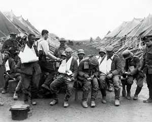 Bandaged: German prisoners given bread and tea, WW1