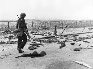 Patrols: German soldier on the beach at Dunkirk, 1940