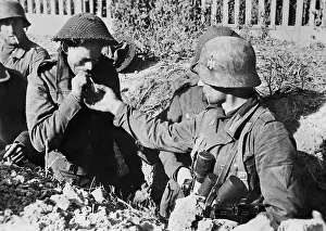 Brits: German soldier with captured Brits, 1943