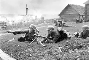 Directions: German soldier in combat for a town, 1942