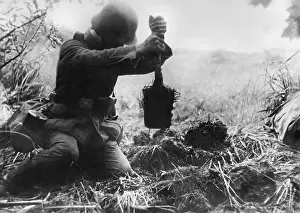 Foxhole: German Soldier Digging a Foxhole