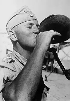 Needed: A German soldier drinking from a water bottle, 1942