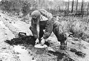 Buries: German soldier lays a tank mine on the Eastern front, 1944