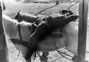 Backward: German soldier sleeps in a march break, 1941