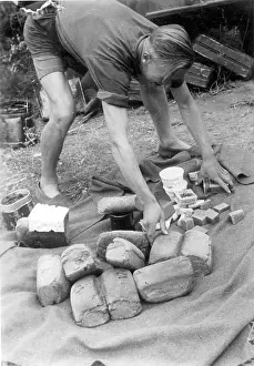 Canned: A German soldier sorts food