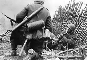 Seized: German soldier takes a Soviet prisoner, 1941