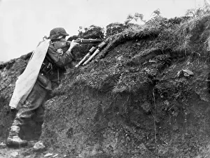 Aims: German soldier in a trench position, 1944