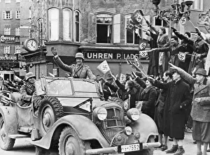 Right Wing: German soldier waving to the Viennese crowd during