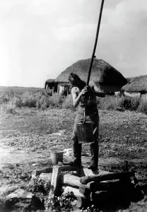 Heine: German soldier at a well, 1942