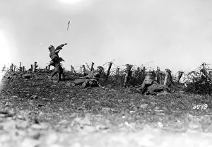German soldiers in front of a barbed wire obstacle during th