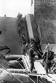 Maastricht: German soldiers crossing a bridge destroyed