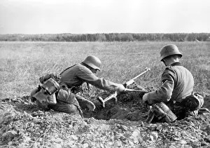 Shovels: German soldiers dig a hole for cover, Eastern front, 1941