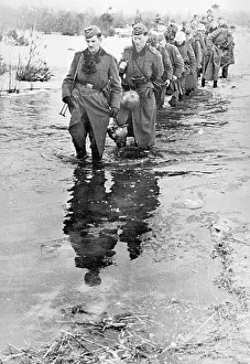 Thaw: German soldiers to ford a stream, 1942