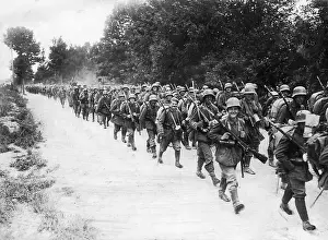 Extracted: German soldiers on the march in a resting position at the fr