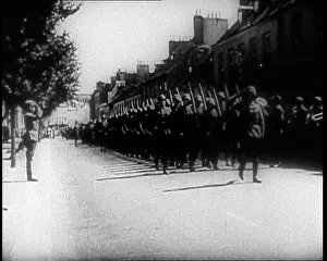 Somewhere: German Soldiers Marching Down a Street Somewhere