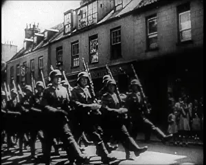 Somewhere: German Soldiers Marching Down a Street Somewhere