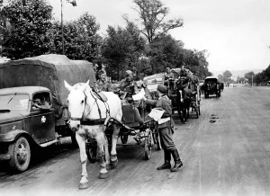 Distribute: German soldiers move to the front through Paris, 1940