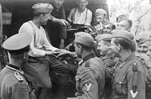 Marshalling: German soldiers receive ammunition before the attack on the