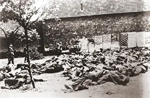 Lidice: German soldiers standing by corpses after ?